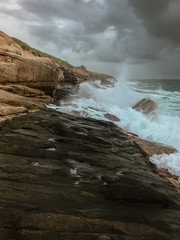 waves crashing on rocks