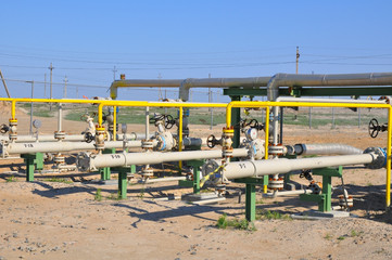 The oil production manifold at the wellsite