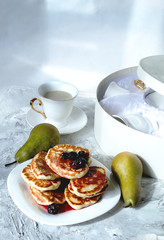 stack of pancakes with syrup on a plate