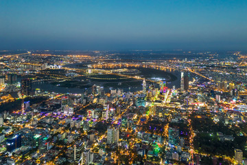 Top view aerial photo from flying drone of a Ho Chi Minh City with development buildings, transportation, energy power infrastructure. Financial and business centers in developed Vietnam.