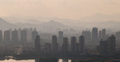Naklejka premium High-rise buildings in misty cities.