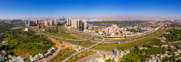 Top view aerial of  Cat Lai crossroads, Ho Chi Minh City with development buildings, transportation, infrastructure, Vietnam. 