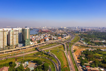 Top view aerial of  Cat Lai crossroads, Ho Chi Minh City with development buildings, transportation, infrastructure, Vietnam. 