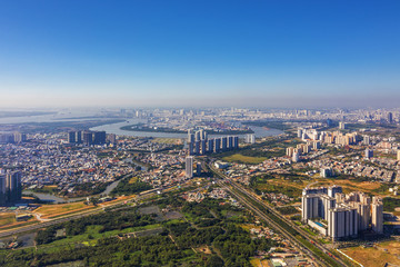 Top view aerial of Mai Chi Tho street. Ho Chi Minh City with development buildings, transportation, energy power infrastructure. Vietnam. View from Cat Lai crossroads