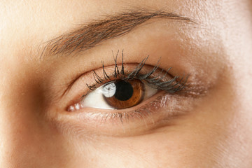 Close up view of a brown woman eye - no make up on	