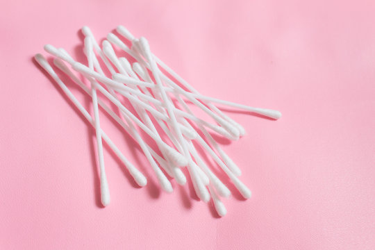 cotton swabs isolated on pink background