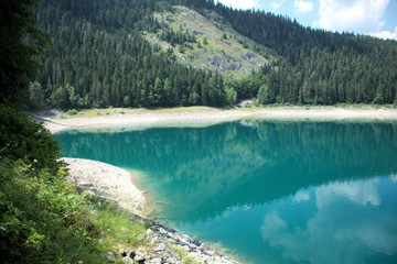 Obraz premium Black lake in the Durmitor mountains near Zabljak. A beautiful place in Montenegro