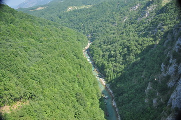 The bridge on the Tara River in Montenegro and the bridge connecting the two banks of the canyon. A...