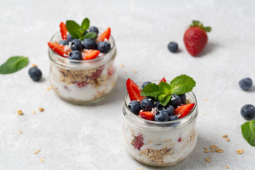 Tasty parfaits made of granola, berries and yogurt. 