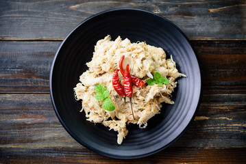 Northern Thai food (Tam Khanun), spicy pounded young jackfruit salad on wooden background, Top view
