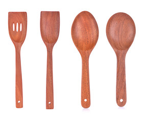 Wooden spatula and ladle on white background.