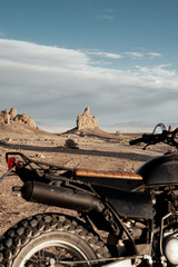 Motorcycle parked on desert landscape in Monument Valley