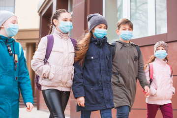 city residents adults and children observe quarantine and go in masks.