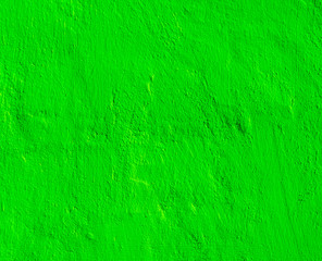 green decorative plaster background , stucco wall with copyspace , color abstraction , wallpaper close up.
