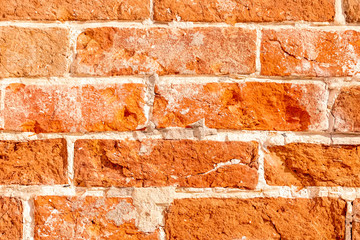 texture of old rough red brick wall , orange ancient bricks background , vintage wallpaper close up , grunge surface macro