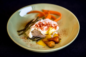 Eggs benedicts on toast, close up view,with green beans.Poached egg on a piece of bread