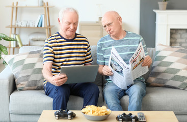 Elderly men resting together at home