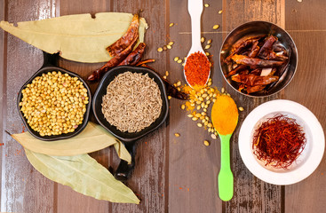 Herbs and Spices with colorful wooden background