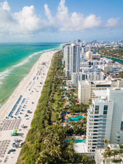 Aerial of Miami Beach, Florida. Stretch of white sands, condos, resorts, hotels and restaurants.