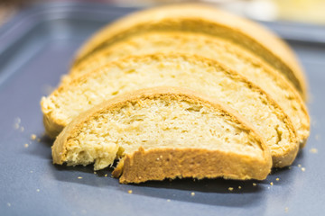 Newly baked and sliced bread in a black tray ready to be served