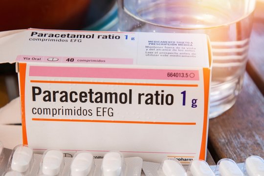 Galicia, Spain April 2, 2020: Paracetamol Box And Pills On Wooden Table