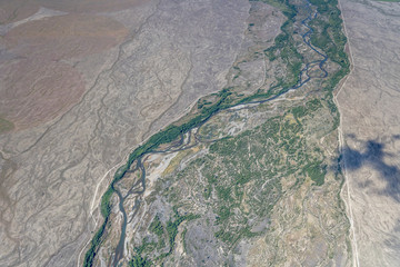 winding shoals of Tekapu river in barren country, near Pukaki,  New Zealand