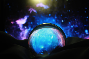 Astrological background. Crystal ball with predictions. Horoscope of the stars. Fortune telling and determination of fate. Soothsayer with a crystal ball.