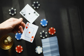 The concept of card tricks and presentations. The concept of a sharpie in games. Flying cards in the air. A magician raises cards with the power of thought.