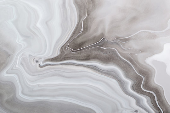 Acrylic Fluid Art. Luxury pattern of monochrome gray colors waves. Marble background or texture