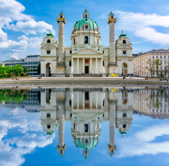 Karlskirche church reflected in pond, Vienna, Austria