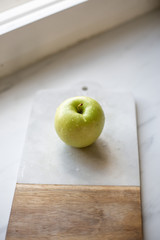 Green Apple on marble background
