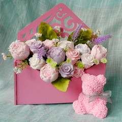 Bouquet of soap flowers and pink rose bear