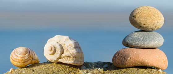 heap of stones and shell on a sea coast, outdoor marine background