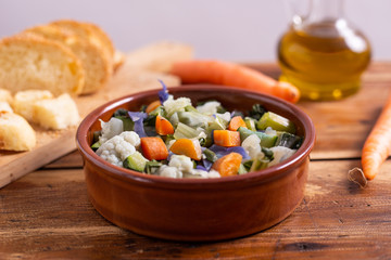 Mixed fresh vegetables with bread. Minestrone, detox food. 