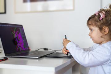 toddler drowing on drawing board