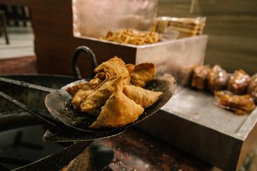 Fresh fried samosa indian fast food street food Rishikesh Delhi Mumbai India
