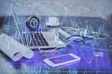 Stock market graph and table with computer background. Double exposure. Concept of financial analysis.