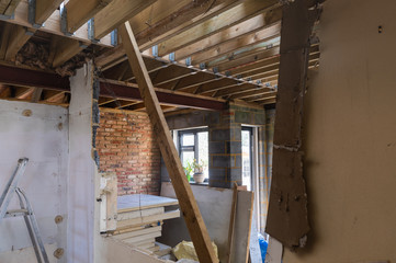 Demolition of the existing wall between the house and new extension. DIY renovation project, selective focus