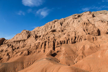 Fototapeta na wymiar baguty red sand mountains tourist attraction with cloudy sky near Almaty, Kazakhstan