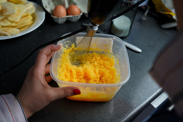 Mixing eggs with sugar. Preparation of the dough for baking homemade pie. Cooking cake at home. Baking during quarantine