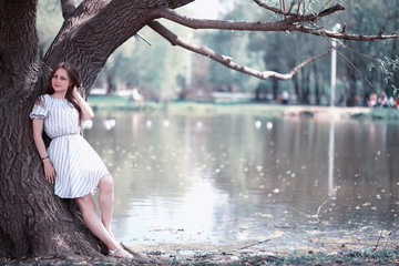 A girl in a spring green park