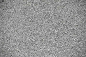 The surface of the rough gray cement wall. High resolution