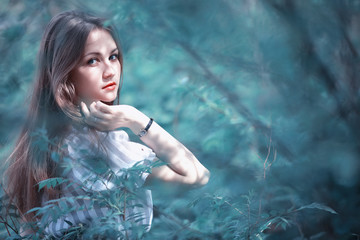 A girl in a spring green park