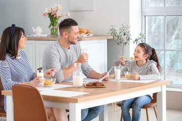 Family drinking milk during breakfast at home