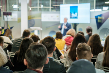 Audience listens lecturer at workshop