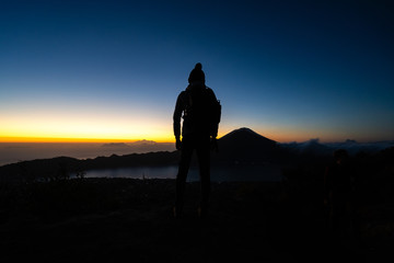 Aerial view of travel people with backpack on volcano Batur in the tropical island Bali. Royalty high quality free stock image of Danau Batur, Indonesia.