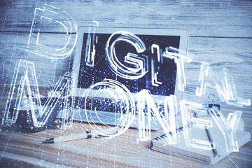 Multi exposure of blockchain and crypto economy theme hologram and table with computer background....