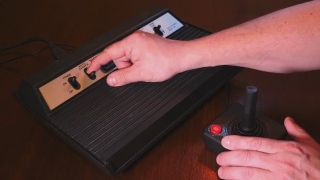 Playing With Vintage TV Video Game Console Joystick. 4K Footage
