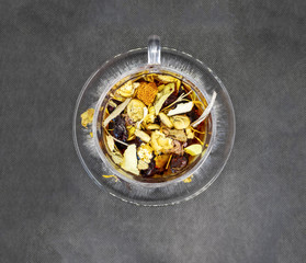  herbal tea on black background isolated top view