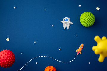 blue background with astronaut, stars and rocket